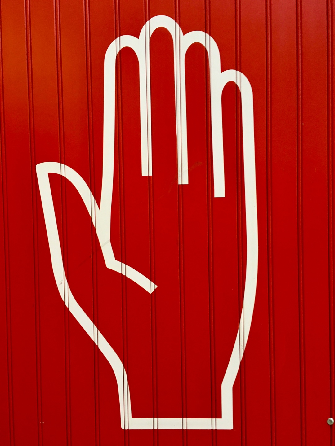 Stop sign with a hand illustration